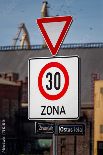 Fototapeta European Give Way Sign with Beginning of 30 km/h Speed Limit Zone