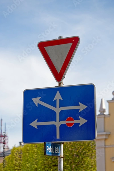 Fototapeta European Give Way Sign with Lane Directions Showing Right Turn Ban and Multiple Allowed Routes