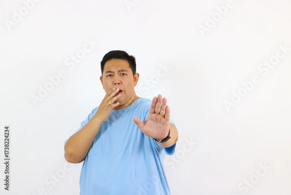 Fototapeta Man Expressing Stop Gesture with Surprised Face