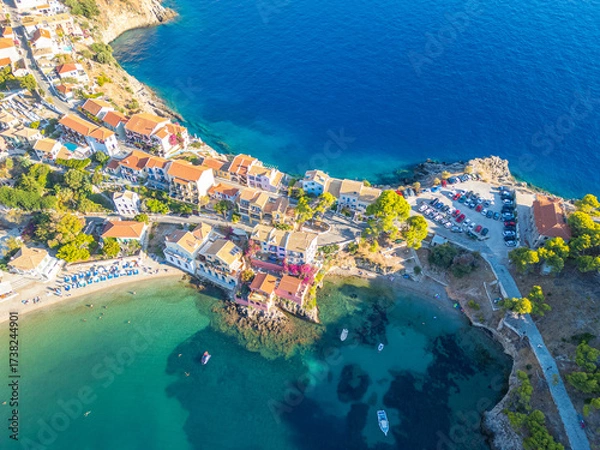 Fototapeta Aerial Panoramic of Assos Village in Kefalonia, Greece: Colorful Houses, Beach, Harbor and crystal clear turquoise waters