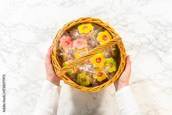 Fototapeta Wrapped Flower Cookies in Easter Basket