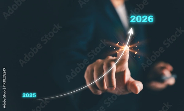 Fototapeta Business growth concept with a futuristic rising arrow from 2025 to 2026, symbolizing progress, success, and financial achievement. Perfect for investment, strategy, and economic development.