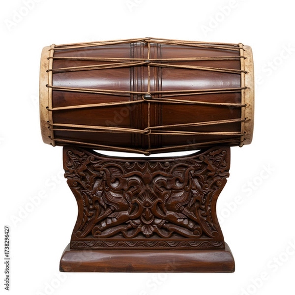 Obraz A brown wood kendang drum stands atop an ornate carved dark wooden stand on white or transparent background
