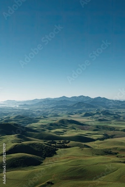 Fototapeta Expansive, blurred landscape view of rolling hills and valleys