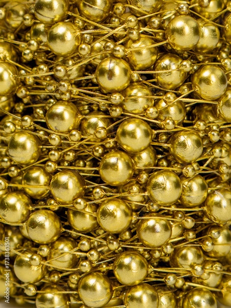 Obraz Background made of a string of large and small round golden beads