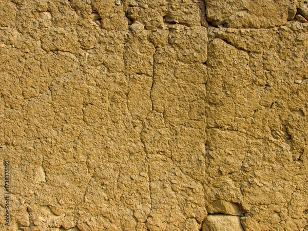 Fototapeta Rustic texture of handmade clay wall from ancient Peruvian architecture.