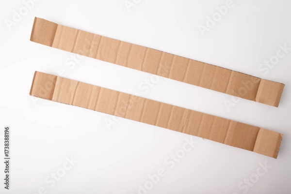 Fototapeta Closeup of cardboard texture with folds, useful for branding visuals in e-commerce, delivery services, packaging design, recycling campaigns, and DIY craft tutorials