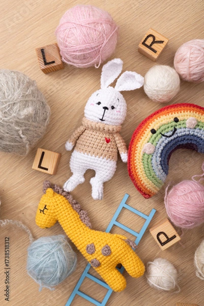 Fototapeta Playful Handmade Toys with Bunny, Giraffe and Rainbow Among Yarn and Letters – Symbol of Joyful Learning