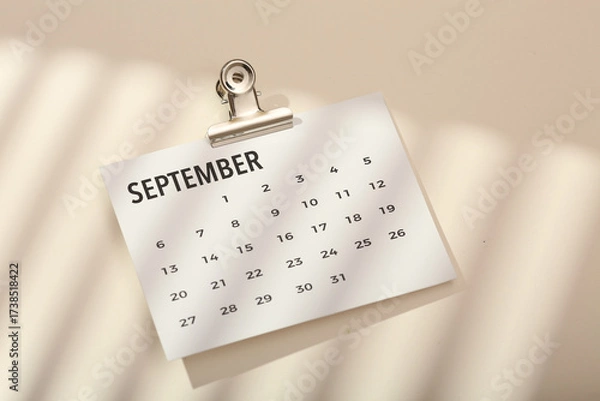 Fototapeta Desktop calendar on a modern desktop. Schedule and time planning in office and business.