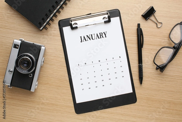 Fototapeta Desktop calendar on a modern desktop. Schedule and time planning in office and business.