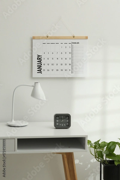 Fototapeta Desktop calendar on a modern desktop. Schedule and time planning in office and business.