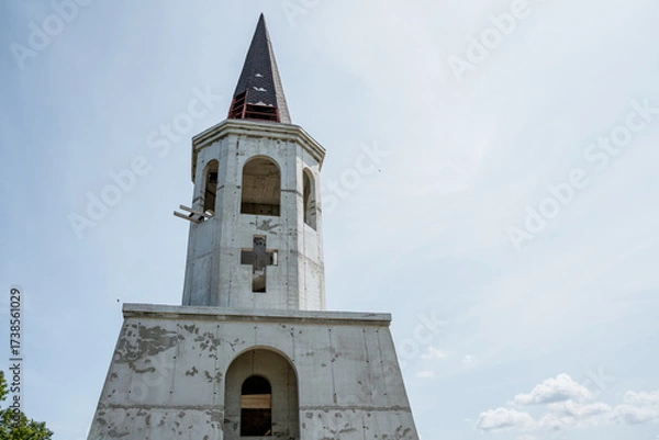 Fototapeta Church with a cross and a pointed roof