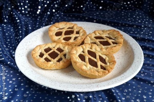 Fototapeta several appetizing cookies with jam on a white plate