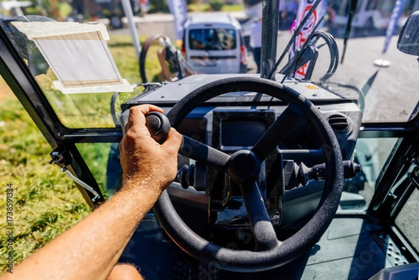 Fototapeta Inside modern tractor. Steering wheel. View from work place