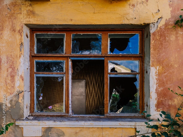 Fototapeta Broken window. Consequences of attack or disaster
