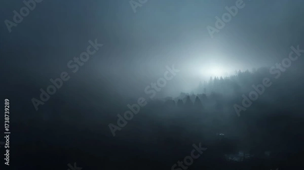 Fototapeta Mysterious fog covering dark, empty space of abstract landscape, creating ethereal atmosphere with soft light filtering through, emphasizing tranquility and solitude. Copy space.