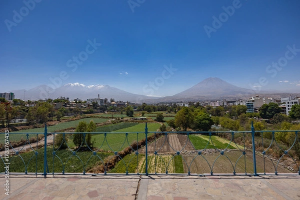 Fototapeta Photographs of the Arequipa viewpoint, mountains in the White City of Peru, panoramic view of the Misti and Chachani volcanoes, perfect for postcards.