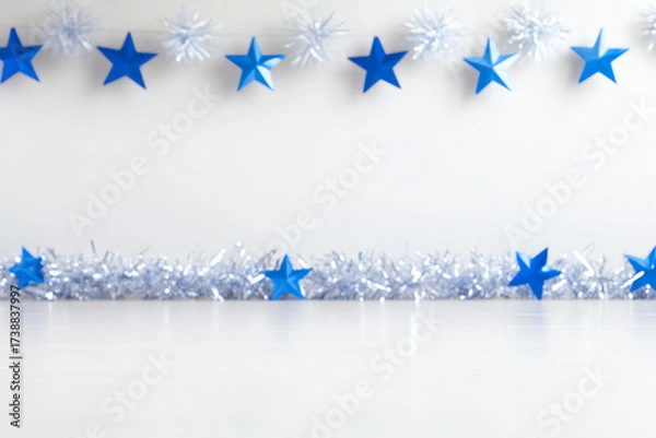 Fototapeta Bright blue and silver decorations with stars, ideal for festive celebrations and holiday events, creating a joyful atmosphere.