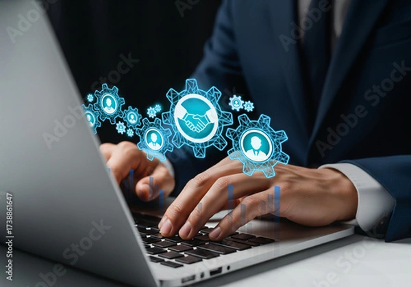 Obraz Digital Collaboration in Modern Business Operations, Laptop surrounded by glowing gear icons for teamwork and HR