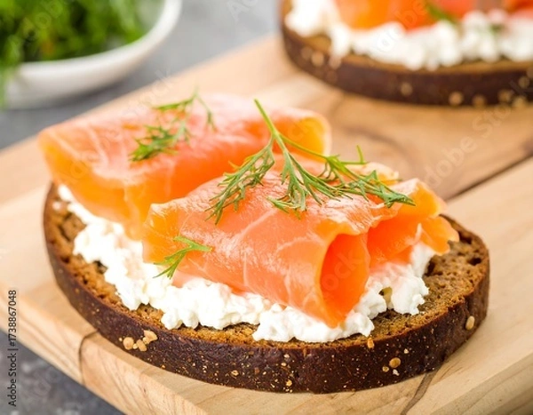 Fototapeta Smoked salmon and cream cheese on rye bread