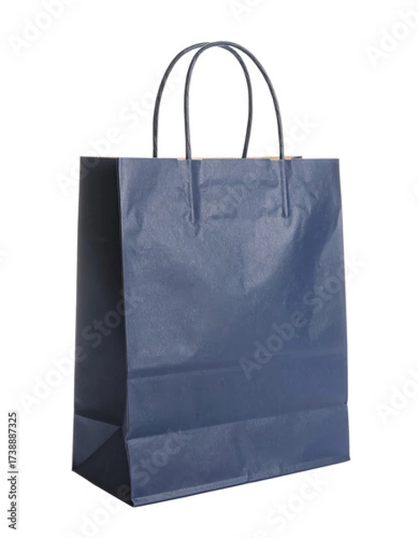 Fototapeta A single dark blue paper shopping bag with handles.