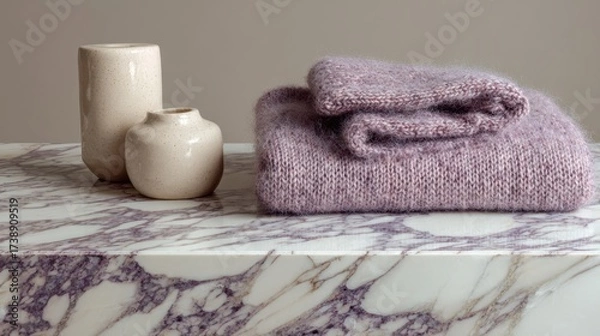 Fototapeta Soft Cozy Knit Blanket with Elegant Decorative Vases on a Marble Surface, Perfect for Modern Home Aesthetics and Interior Design Inspiration