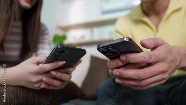 Fototapeta Smartphone Interaction. Friends enjoying digital moments together in a relaxed environment.