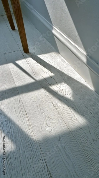 Fototapeta Aesthetic shadows cast on light wooden floor in a modern space.