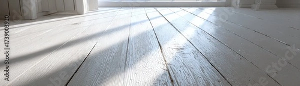 Fototapeta Bright, sunlit wooden floor creating an inviting atmosphere.