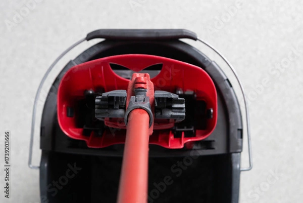 Fototapeta Vacuum cleaner in action showcasing its design and functionality on a clean floor