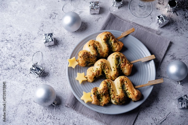 Fototapeta Basil mozzarella garlic Puff pastry pies in the form of Christmas tree for Christmas holidays