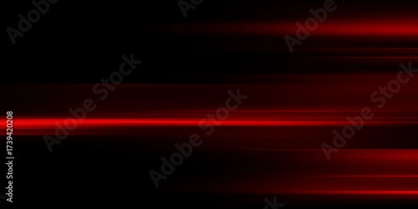 Obraz The effect of red light in fast motion on a black background. blurred abstract background with long exposure. neon light
