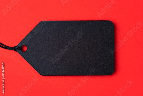 Fototapeta Empty black tag on red background.
