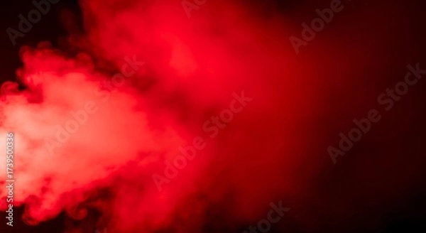 Fototapeta Vibrant Red Smoke Plumes Flowing Across a Dark Backdrop Creating an Abstract Texture