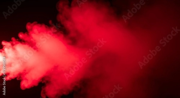 Fototapeta Intense red smoke effect on black background creating a dramatic scene