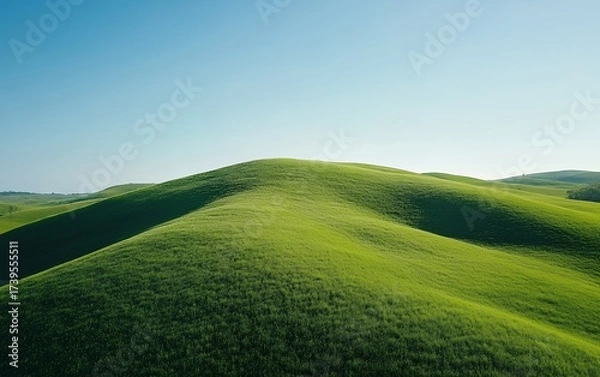Obraz Lush green rolling hills with smooth contours under a pristine blue sky, showcasing the beauty of unspoiled nature and pastoral landscapes