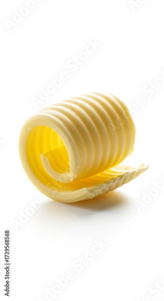 Fototapeta A single curl of fresh butter on a white background