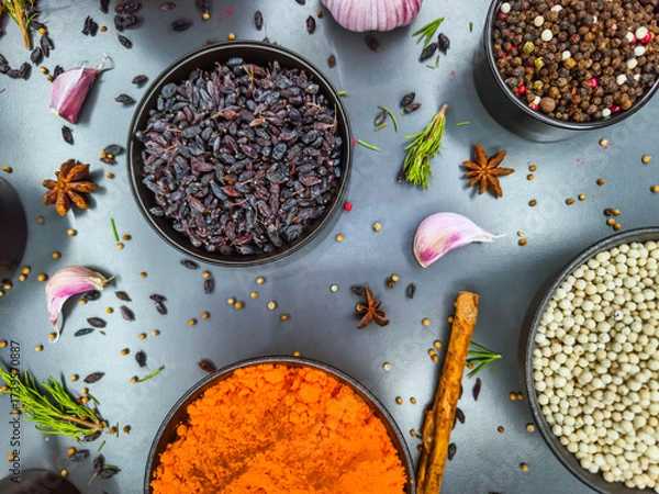 Fototapeta Bright spices and herbs arranged beautifully on a kitchen countertop for flavorful cooking exploration in a home setting