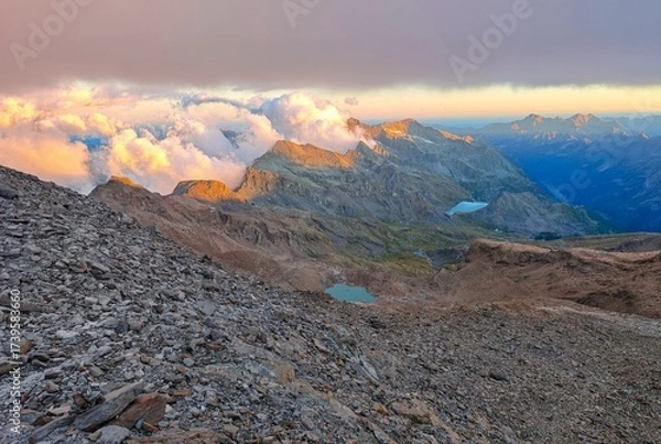 Fototapeta Monte Rosa (Italy) - A mountains view in Valsesia with Monte Rosa mount peak of Alps, alpinistic paths to Rifugio Modena and Capanna Margherita refuge, with snow glacier and alpinists.