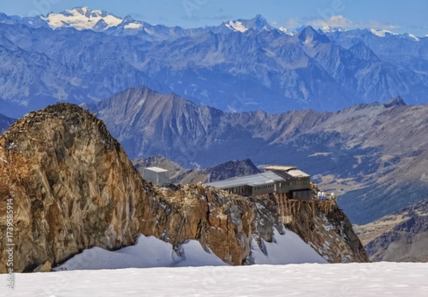 Fototapeta Monte Rosa (Italy) - A mountains view in Valsesia with Monte Rosa mount peak of Alps, alpinistic paths to Rifugio Modena and Capanna Margherita refuge, with snow glacier and alpinists.