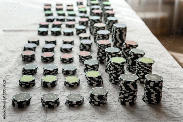 Obraz Casino chips on the table. Coins for board games.