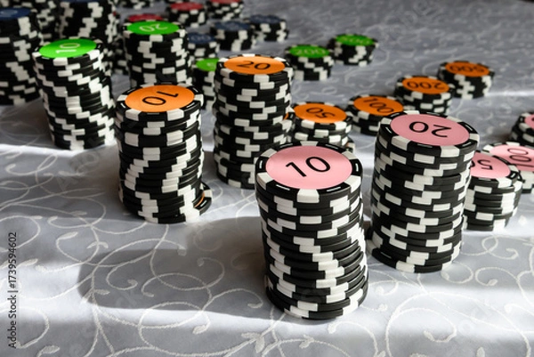 Obraz Casino chips on the table. Coins for board games.