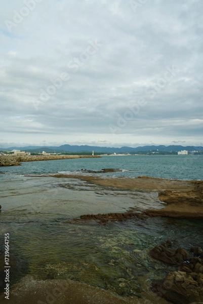 Fototapeta 海岸と曇り空