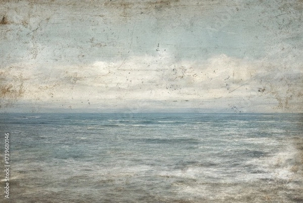 Obraz A serene, aged seascape showcasing a misty horizon, subtle waves, and a muted, cloudy sky