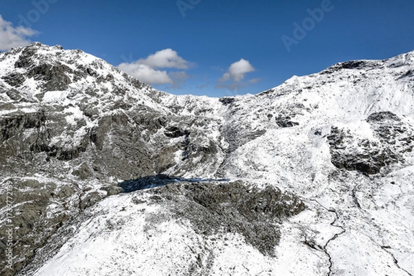 Fototapeta Campagneda pass and Campagneda lake in Valmalenco, drone view after snowfall