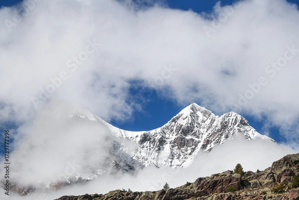 Fototapeta Among the clouds, Piz Argient and Piz Zupò in the Bernina massif