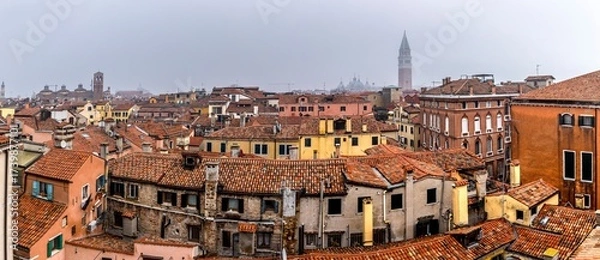 Fototapeta Venice, Italy - February 8, 2025: Aerial view on the roofs of Venice with St Marks Basilica in background