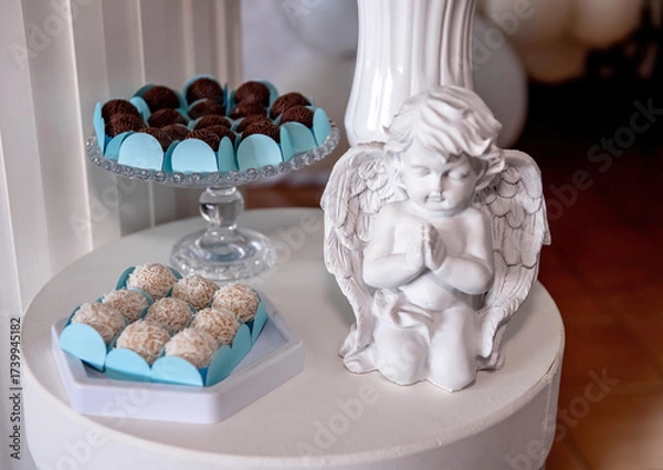 Obraz Sweets table with ceramic angel at baptism party