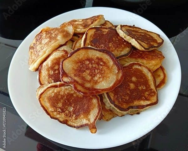 Fototapeta delicious pancakes on a white plate