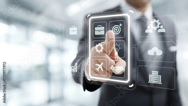 Obraz Businessman in a suit interacting with a futuristic virtual interface displaying icons such as briefcase, target, handshake, airplane, lightbulb, and cloud, symbolizing modern business, innovation, an